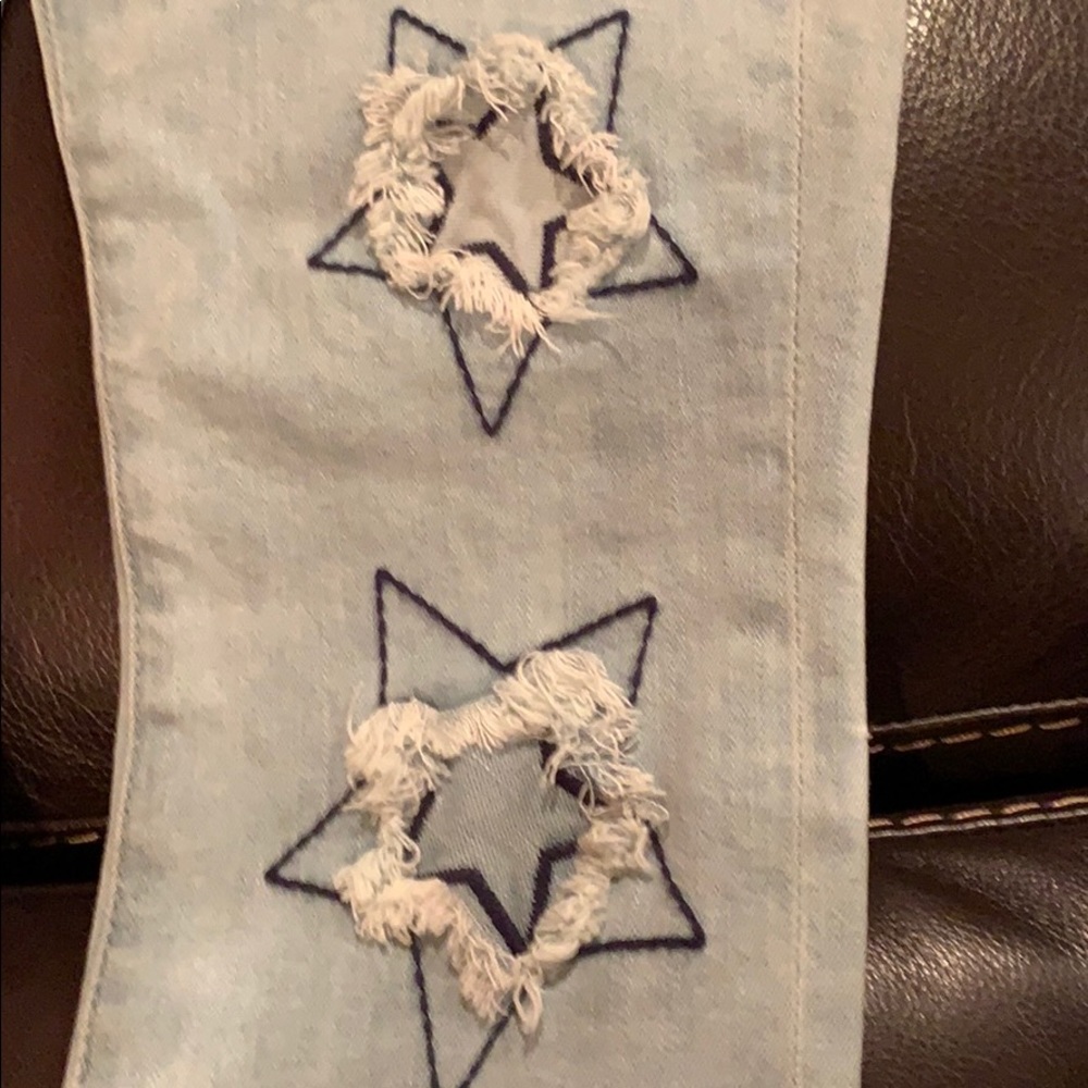 Skinny Jean with stars on left leg